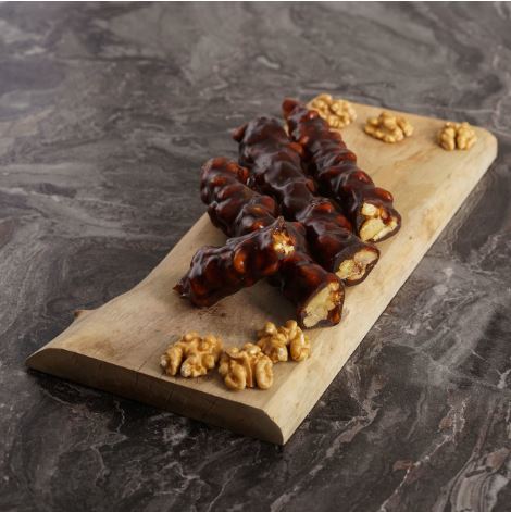 Walnut stick in grape syrup coating